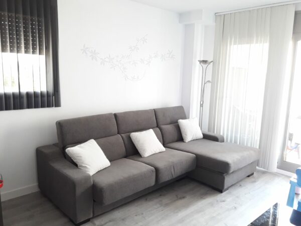 sofa gris chaiselongue reposacabezas abatibles